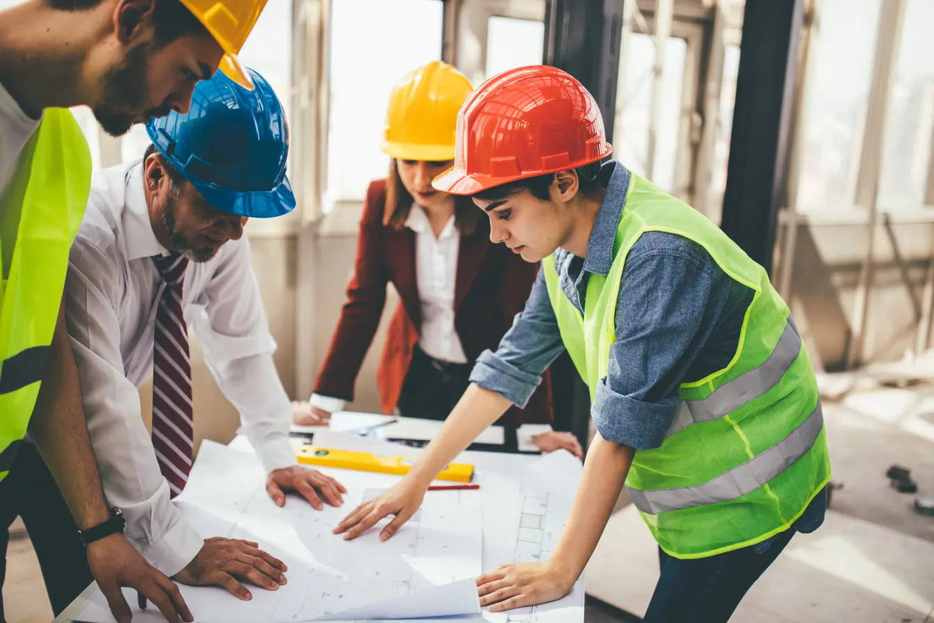 Construction specialists planning a technical project